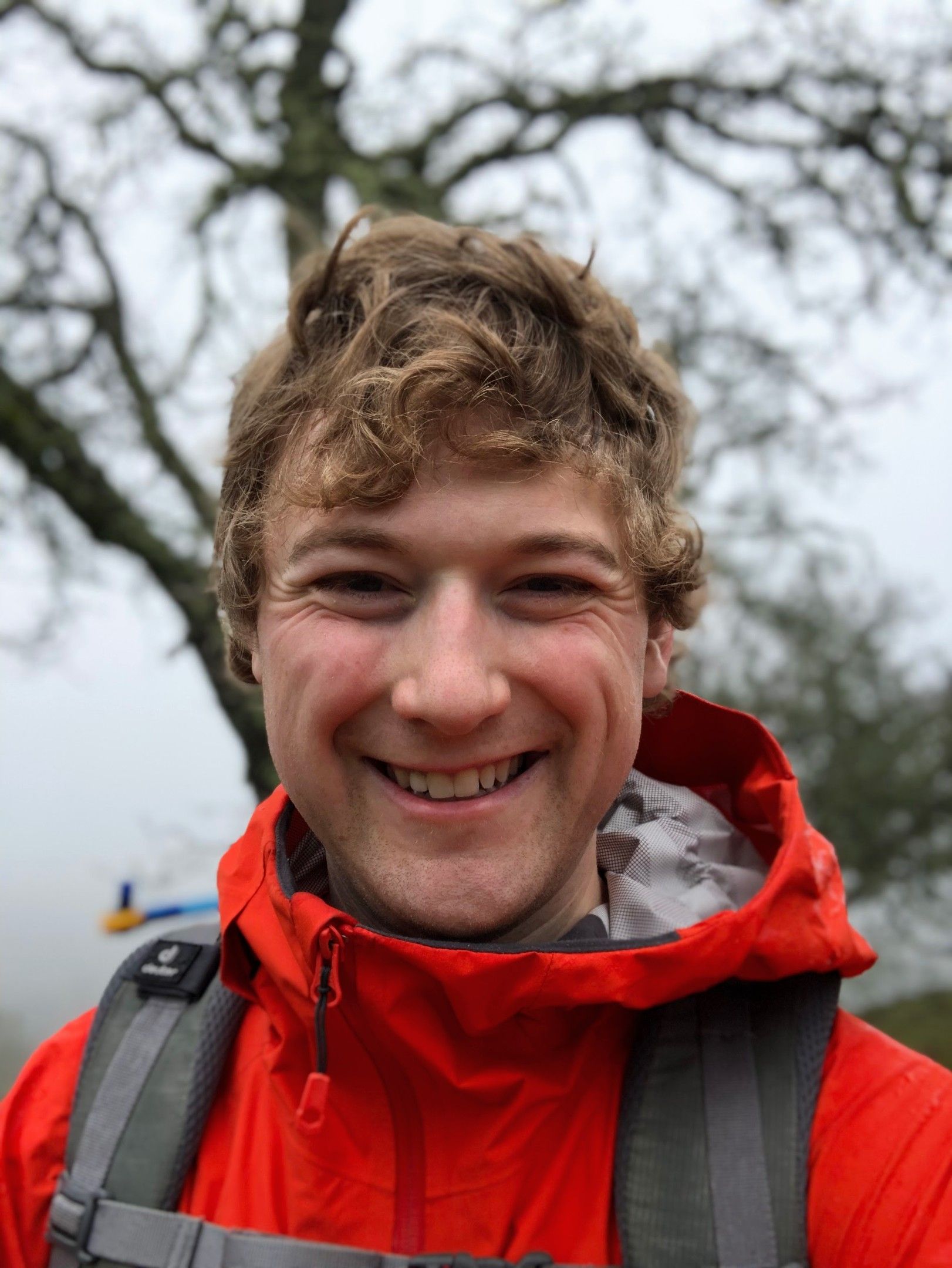 Alex backpacking along a foggy ridgeline